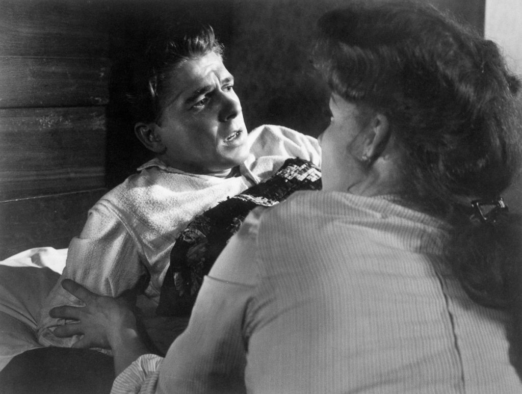 1942 --- Original caption: Movie still from Kings Row, with Ronald Reagan. --- Image by © Bettmann/CORBIS