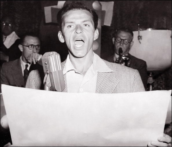 LONDON, ENGLAND: Legendary US singer Frank Sinatra in a picture taken 07 March 1950 in London performs on stage at Palladium Theater. Frank Sinatra, born 12 December 1915, was a playboy who married four times, twice to famous actress, Ava Gardner and Mia Farrow. But he was deeply attracted to the actress; his biographer Kitty Kelley wrote that Gardner was the only woman he respected because he knew he could not dominate her. Sinatra got married for the last time in 1976 to Barbara Marx, widow of comedian Zeppo Marx of the four Marx brothers. Sinatra number his conquests, according to Kelley, among Hollywood's greatest beauties, including Marlene Dietrich, Judy Garland, Natalie Wood, Elizabeth Taylor and Victoria Principal. (Photo credit should read AFP/AFP/Getty Images)