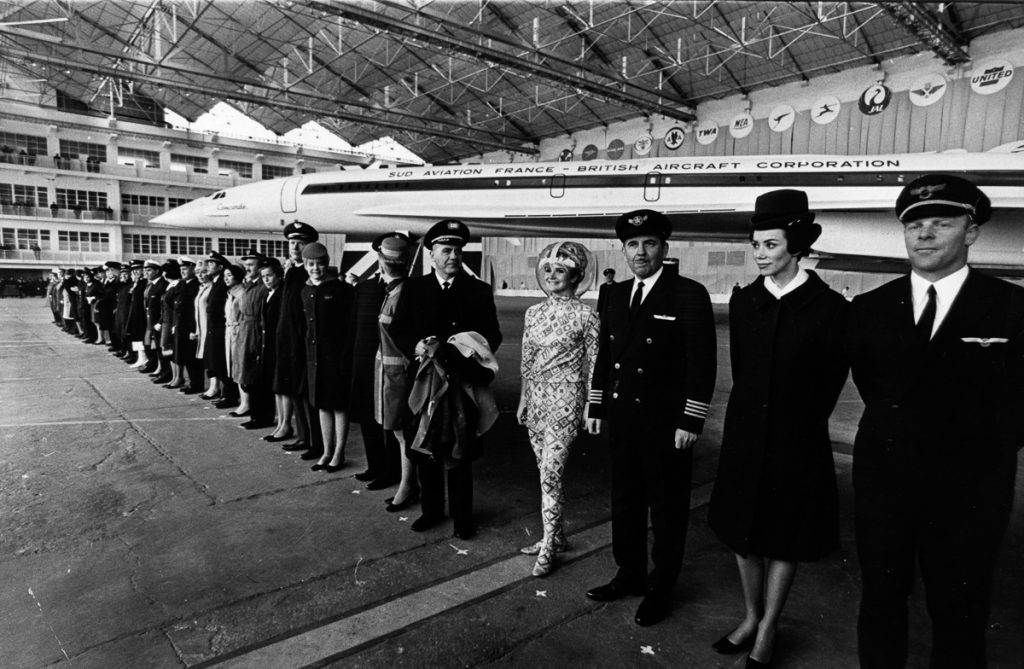 11th December 1967: Pilots and hostesses from airliners which have ordered Concorde, the world's first supersonic airliner, stand in front of the plane at the official roll-out ceremony in Toulouse. The space-age hostess is from America's Braniff International. (Photo by Keystone/Getty Images)