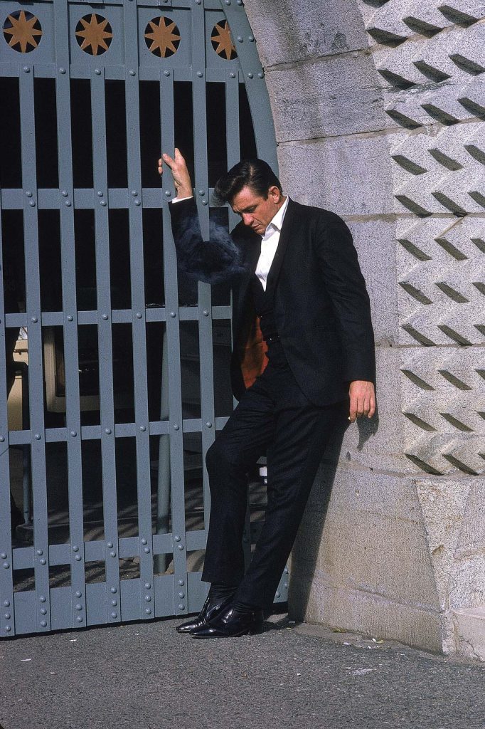 Country singer Johnny Cash poses outside the Folsom Prison in California on January 13, 1968, the day he recorded his live album "Johnny Cash at Folsom Prison." (AP Photo/Dan Poush)