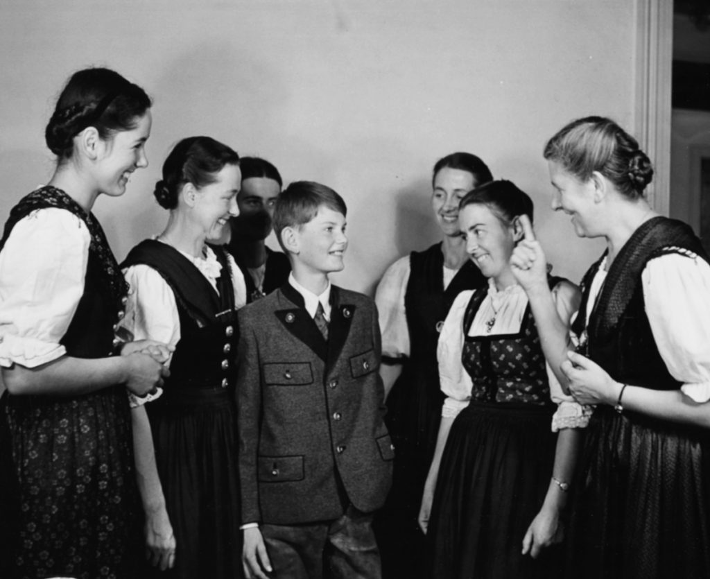Portrait of Baroness Maria Von Trapp (right) talking to her children, including Johannes (centre) who is the youngest family member, London, circa 1950. (Photo by George Konig/Keystone Features/Getty Images)