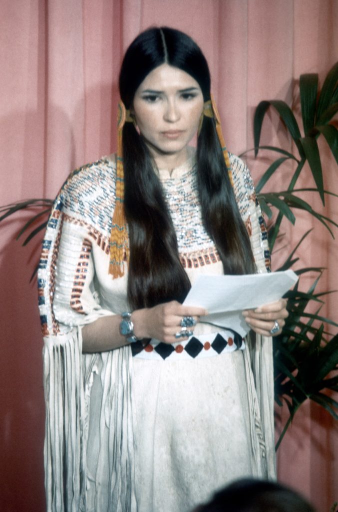 March 27 - LOS ANGELES: Sacheen Littlefeather (Native American actress Maria Cruz) holds a written statement from actor Marlon Brando refusing his Best Actor Oscar on stage at the Academy Awards on March 27, 1973 in Los Angeles, California. (Photo by Michael Ochs Archvies/Getty Images)