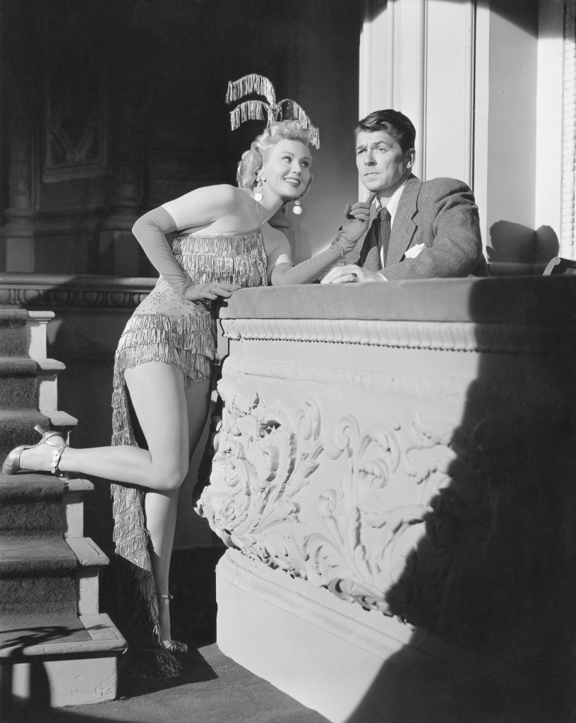 1952 --- Original caption: Virginia Mayo and Ronald Reagan in She's Working Her Way Through College. A Warner Brothers production. --- Image by © Corbis